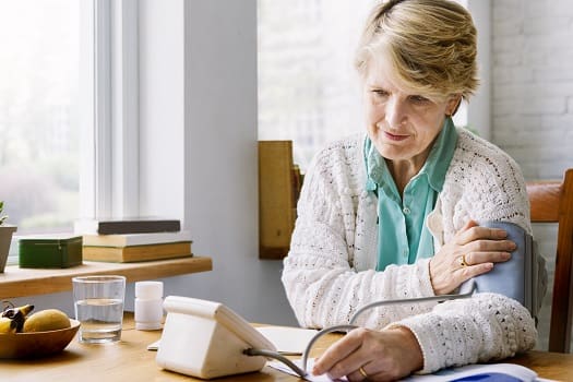 https://ambienceinhomecare.com/wp-content/uploads/2018/11/Elderly-Woman-Checking-Her-Blood-Pressure.jpg