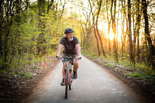 A man riding his bike down the road